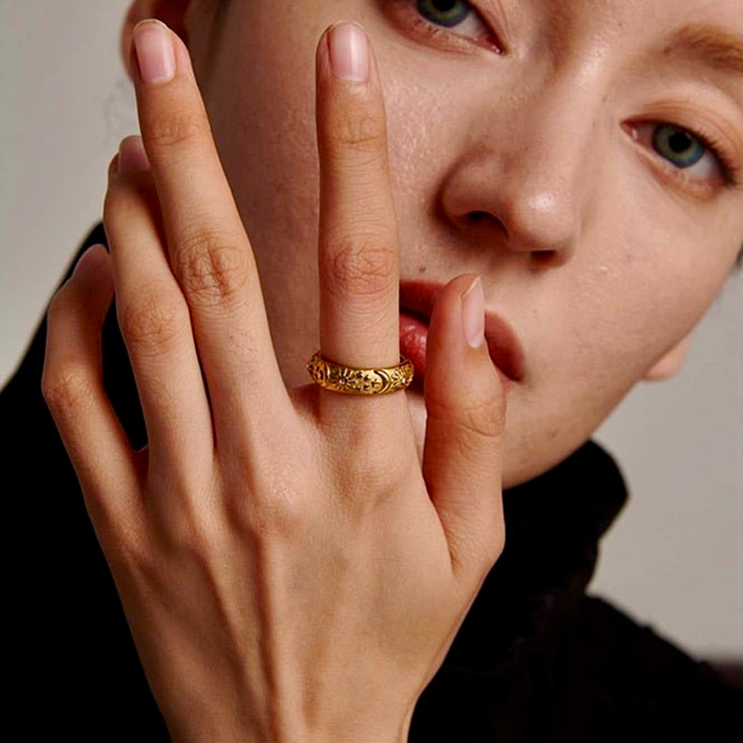 A model wearing the Lunar Elegance Ring, showcasing its celestial gold design on the finger.