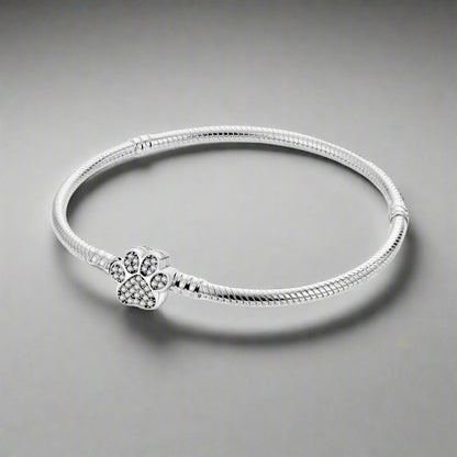 Front view of the Paw Print Crystal Bracelet, featuring a silver design with a sparkling crystal-studded paw charm.