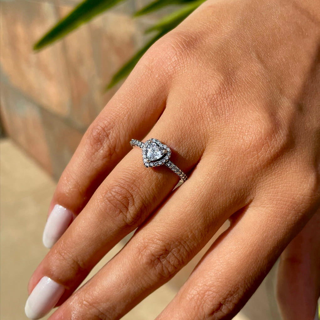 Radiance Wishbone Ring displayed on a hand, showcasing the sparkling zircon and sterling silver craftsmanship.