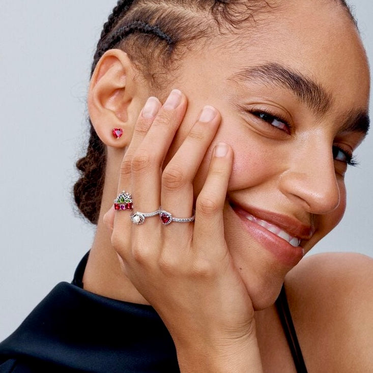 A model wearing the Radiant Ruby Heart Ring, highlighting its elegant sterling silver design and ruby centerpiece.