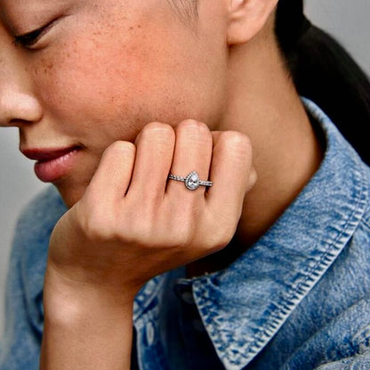 Radiant Teardrop Ring worn on a hand, showcasing its sleek sterling silver band and sparkling teardrop zircon.