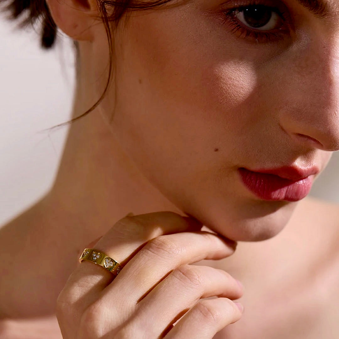 Model wearing stacked Seraphine Halo Rings in gold, adding a touch of sophistication and glamour.