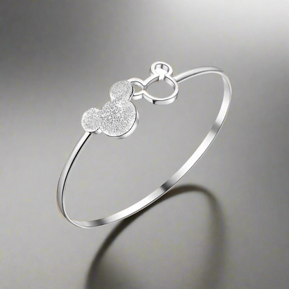 Lustre Harmony Bracelet in silver with heart design and shimmering accents on display.