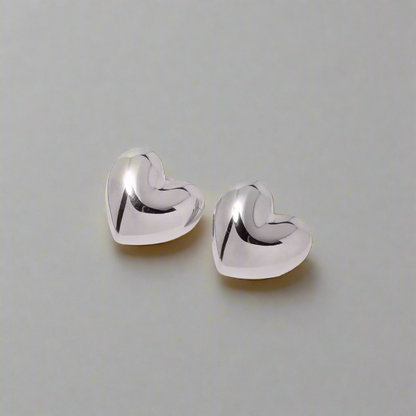 Trendy silver heartbeat stud earrings, perfect for modern elegance and everyday wear.