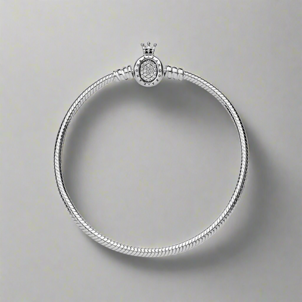 A minimalistic view of the Silver Majesty Charm Bracelet lying flat, highlighting the snake chain design and zircon clasp.