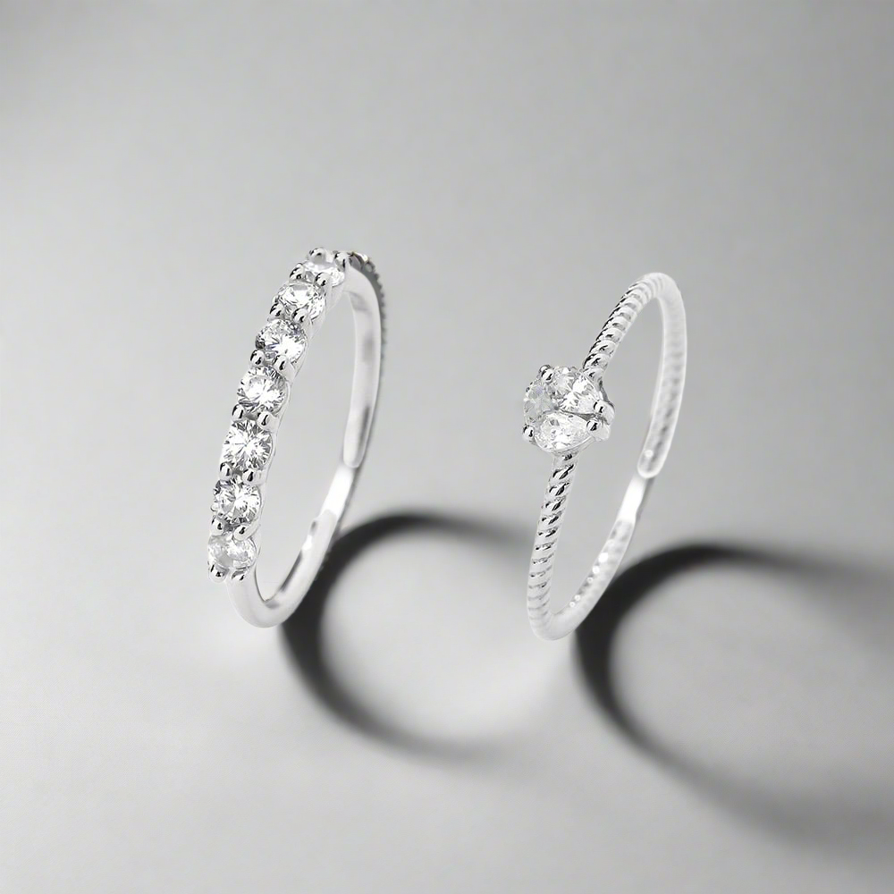 Stellar Embrace Ring in silver with an adjustable open band and shimmering zircon detailing.