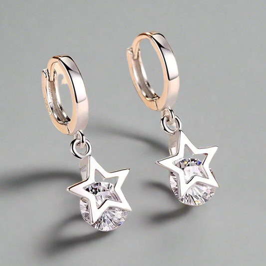 Front view of Stellar Sparkle Earrings with star-shaped zircon stones in sterling silver.