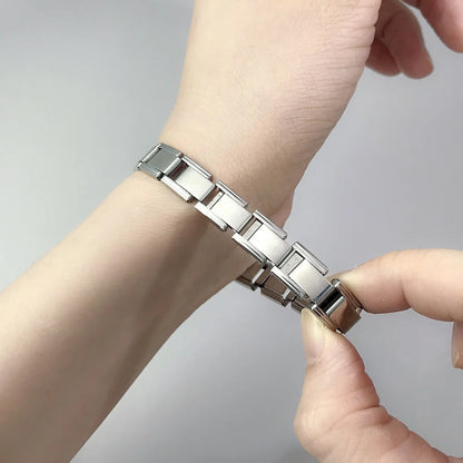 Timeless Elegance Link Bracelet in silver finish, elegantly worn on a wrist, showcasing its minimalist style.